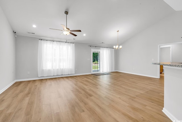 unfurnished living room featuring ceiling fan, light wood finished floors, a chandelier, baseboards, and recessed lighting