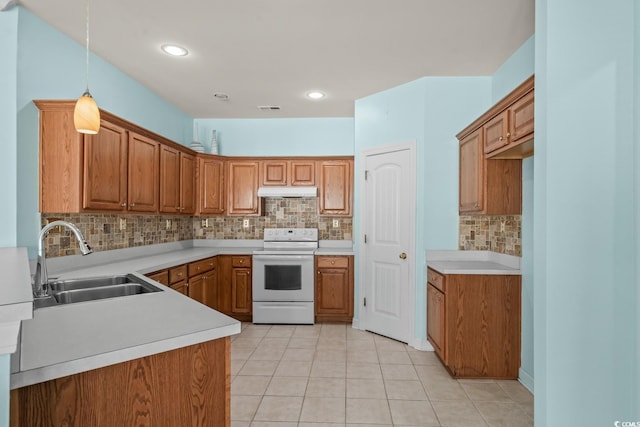 6244 Catalina Dr Unit 511, North Myrtle Beach, SC 29582 - kitchen with white electric range oven, a sink, brown cabinets, tasteful backsplash, and light tile patterned floors