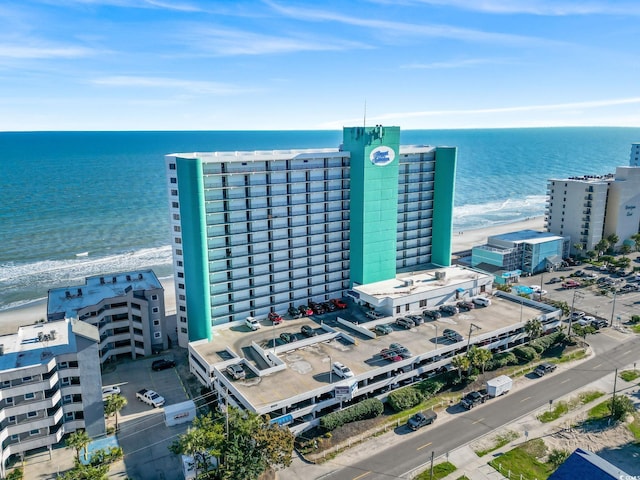aerial view of a large body of water and apartment complex