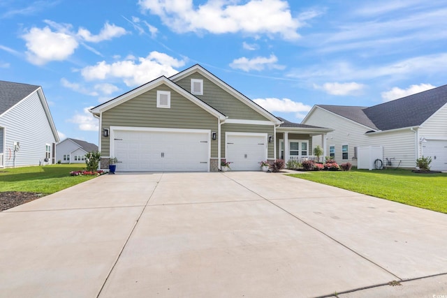 122 New Paradise Way, Myrtle Beach, SC 29588 - view of front of home with a front lawn, an attached garage, and concrete driveway