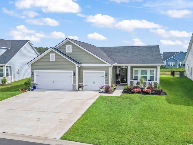 122 New Paradise Way, Myrtle Beach, SC 29588 - view of front facade featuring covered porch, a garage, driveway, a front lawn, and roof with shingles