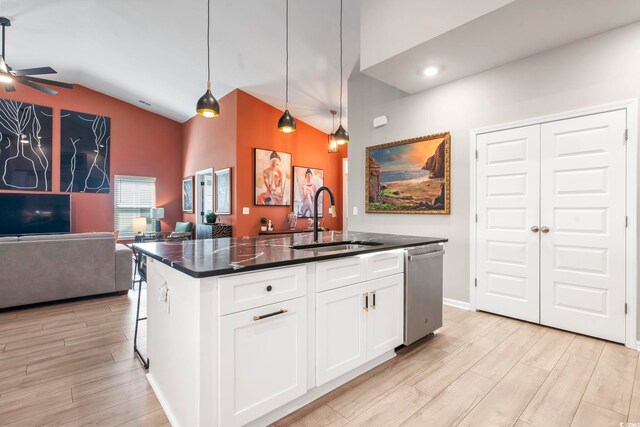122 New Paradise Way, Myrtle Beach, SC 29588 - kitchen featuring stainless steel dishwasher, a sink, open floor plan, dark countertops, and a ceiling fan