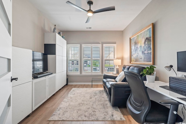 home office with ceiling fan and light wood-style floors