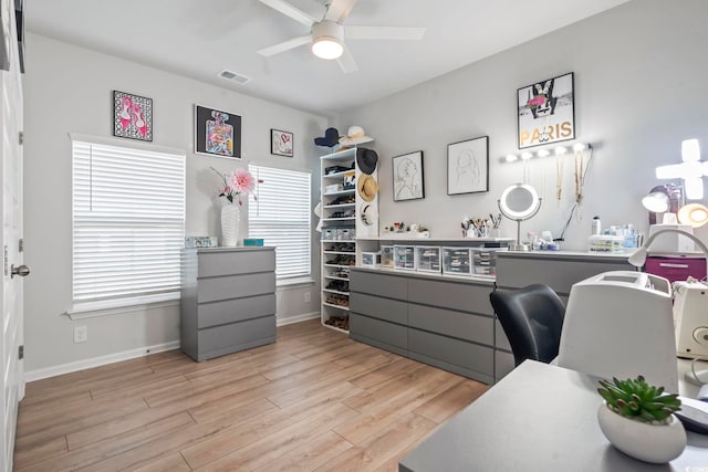 office space with ceiling fan, wood finished floors, and baseboards