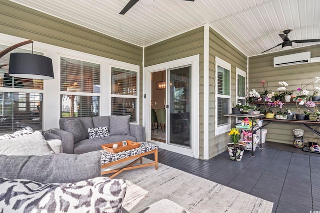 view of patio / terrace with a ceiling fan, a wall unit AC, an outdoor hangout area, and covered porch