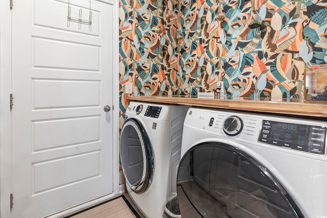 laundry room featuring washing machine and clothes dryer