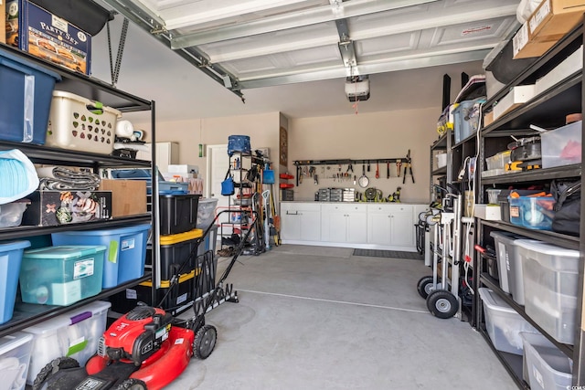 122 New Paradise Way, Myrtle Beach, SC 29588 - garage with a garage door opener and a workshop area