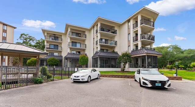 307 74th Ave N Unit 3C, Myrtle Beach, SC 29572 - view of apartment building / complex featuring uncovered parking