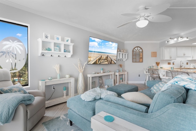 307 74th Ave N Unit 3C, Myrtle Beach, SC 29572 - living area featuring light wood-style flooring, crown molding, baseboards, and ceiling fan