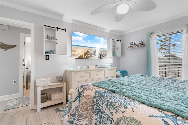 307 74th Ave N Unit 3C, Myrtle Beach, SC 29572 - bedroom with crown molding, light wood finished floors, a ceiling fan, and baseboards