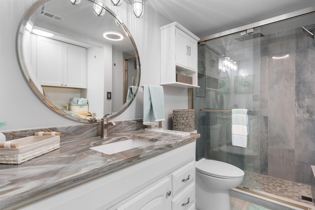 307 74th Ave N Unit 3C, Myrtle Beach, SC 29572 - bathroom featuring vanity, a shower stall, and toilet