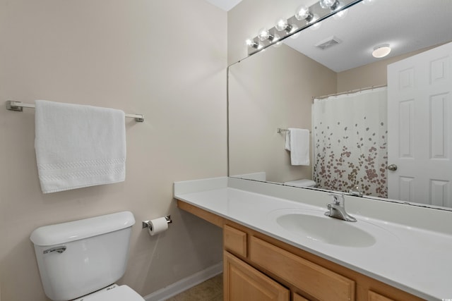 4940 Windsor Green Way Unit 301, Myrtle Beach, SC 29579 - bathroom featuring toilet, vanity, tile patterned flooring, baseboards, and a shower with curtain