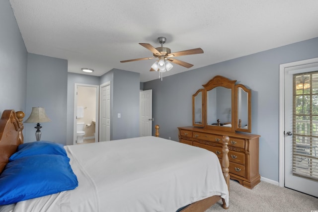 4940 Windsor Green Way Unit 301, Myrtle Beach, SC 29579 - carpeted bedroom with connected bathroom, ceiling fan, access to exterior, baseboards, and a textured ceiling