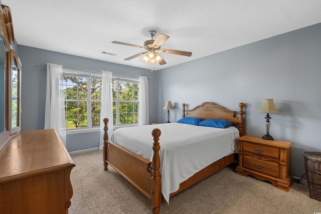 4940 Windsor Green Way Unit 301, Myrtle Beach, SC 29579 - bedroom with light colored carpet, a textured ceiling, ceiling fan, and baseboards
