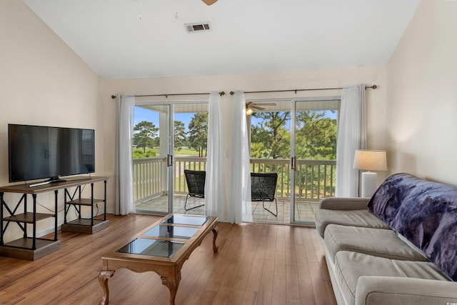 4940 Windsor Green Way Unit 301, Myrtle Beach, SC 29579 - living room featuring vaulted ceiling, ceiling fan, and wood finished floors