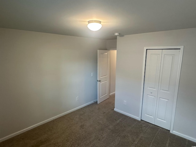 198 Foxford Dr, Conway, SC 29526 - unfurnished bedroom with dark carpet, baseboards, and a closet