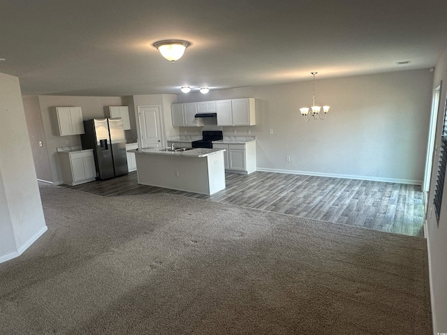 198 Foxford Dr, Conway, SC 29526 - kitchen with stainless steel refrigerator with ice dispenser, black range with electric stovetop, open floor plan, and baseboards