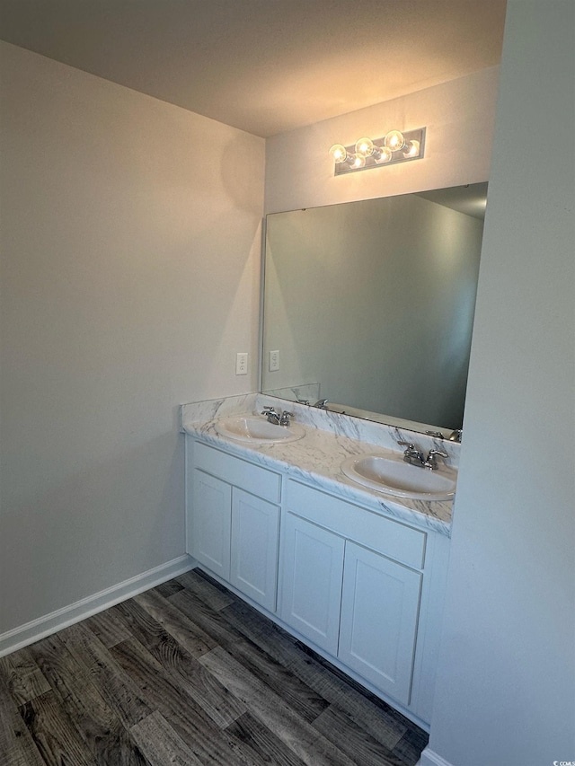 198 Foxford Dr, Conway, SC 29526 - bathroom featuring wood finished floors, double vanity, and baseboards