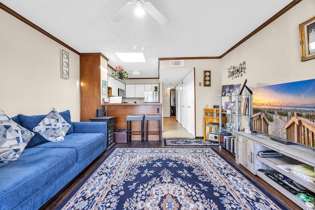 4350 Intercoastal Dr Unit 2402, Little River, SC 29566 - living room with wood finished floors, crown molding, a textured ceiling, and a ceiling fan