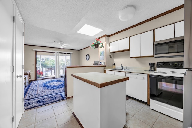 4350 Intercoastal Dr Unit 2402, Little River, SC 29566 - kitchen with stainless steel microwave, electric range oven, white dishwasher, crown molding, and white cabinets