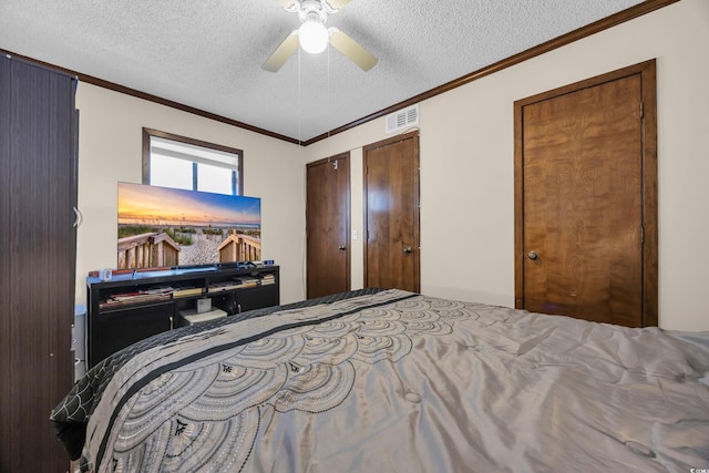 4350 Intercoastal Dr Unit 2402, Little River, SC 29566 - bedroom with a textured ceiling, ornamental molding, and a ceiling fan