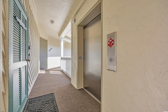 4350 Intercoastal Dr Unit 2402, Little River, SC 29566 - hallway featuring carpet flooring, a textured wall, and elevator