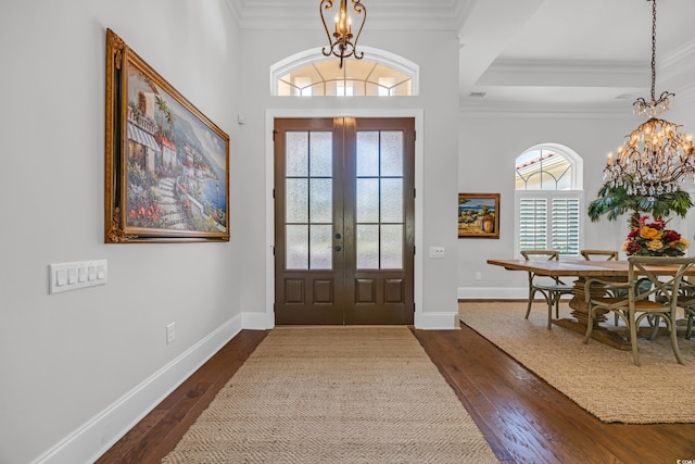 7202 Seville Dr, Myrtle Beach, SC 29572 - entryway featuring a chandelier, dark wood-type flooring, crown molding, french doors, and baseboards