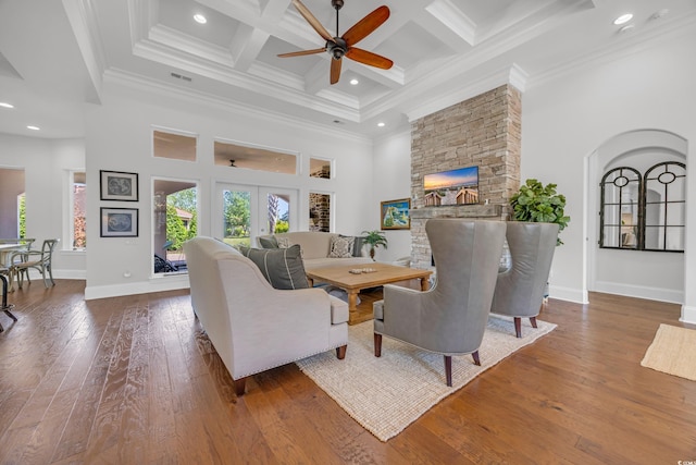 7202 Seville Dr, Myrtle Beach, SC 29572 - living area featuring ceiling fan, a towering ceiling, coffered ceiling, baseboards, and wood-type flooring