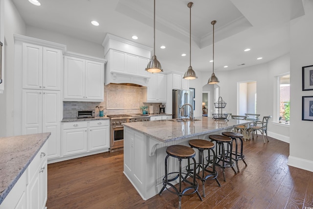 7202 Seville Dr, Myrtle Beach, SC 29572 - kitchen with stainless steel appliances, a sink, recessed lighting, tasteful backsplash, and dark wood-type flooring
