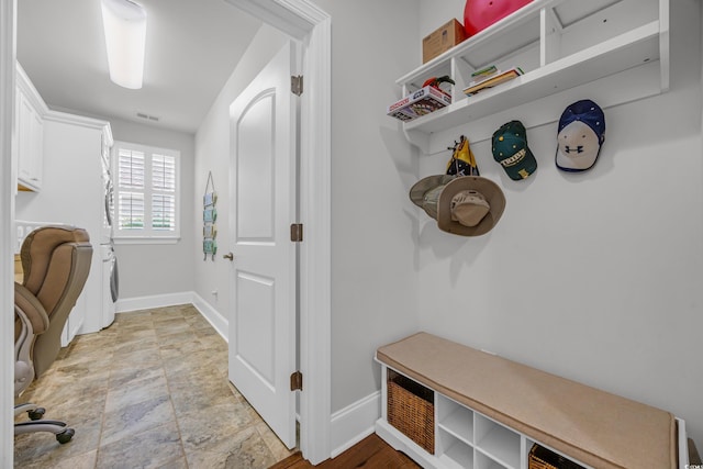 7202 Seville Dr, Myrtle Beach, SC 29572 - mudroom with baseboards and light stone finish floors