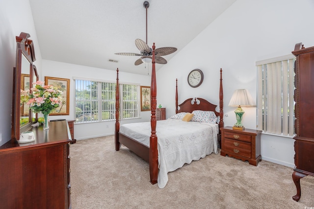carpeted bedroom featuring vaulted ceiling, baseboards, and ceiling fan