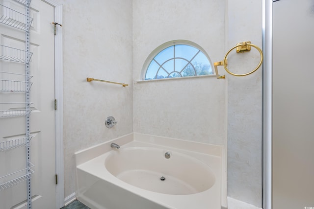 full bath with a garden tub