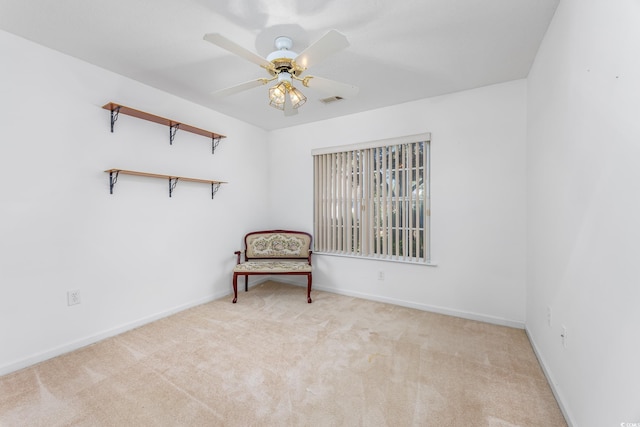 unfurnished room with carpet flooring, baseboards, and ceiling fan