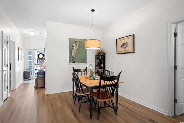 1058 Sea Mountain Hwy Unit 9-101, North Myrtle Beach, SC 29582 - dining area with wood finished floors and baseboards