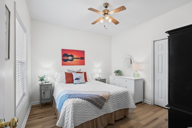 1058 Sea Mountain Hwy Unit 9-101, North Myrtle Beach, SC 29582 - bedroom with multiple windows, light wood-type flooring, and ceiling fan