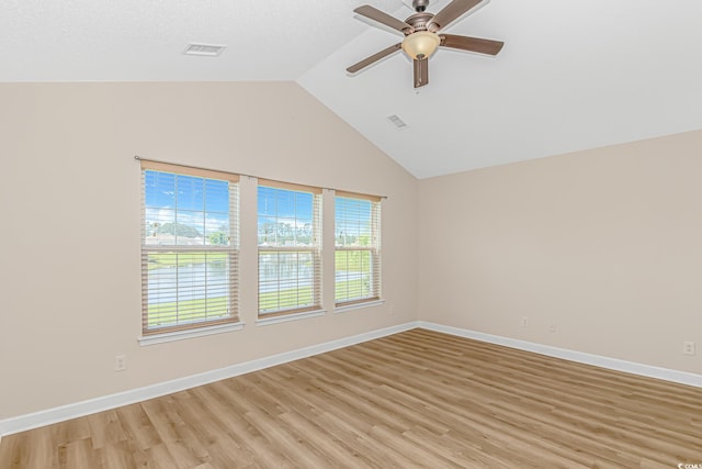 5 Coffee Mill Creek Ln, Carolina Shores, NC 28467 - spare room featuring light wood-style floors, ceiling fan, vaulted ceiling, and baseboards