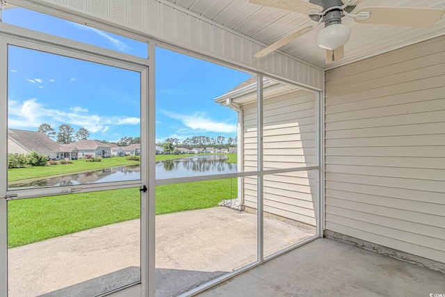 5 Coffee Mill Creek Ln, Carolina Shores, NC 28467 - unfurnished sunroom featuring a water view, ceiling fan, a residential view, and plenty of natural light