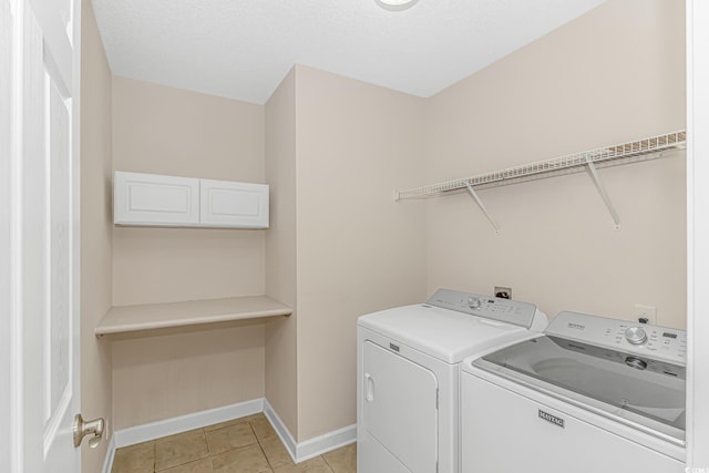 5 Coffee Mill Creek Ln, Carolina Shores, NC 28467 - laundry area featuring washing machine and dryer, baseboards, and light tile patterned flooring