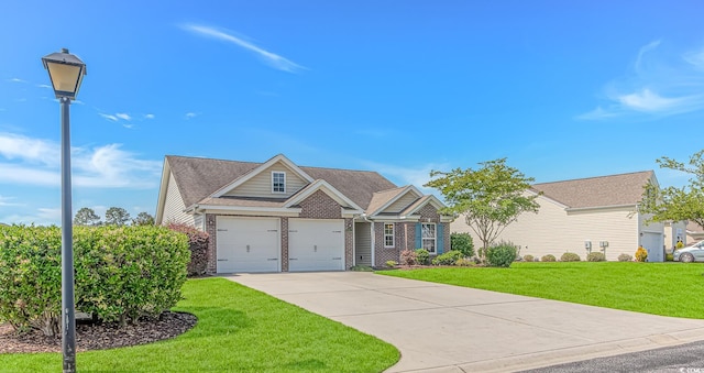 5 Coffee Mill Creek Ln, Carolina Shores, NC 28467 - view of front of property with driveway, brick siding, and a front yard