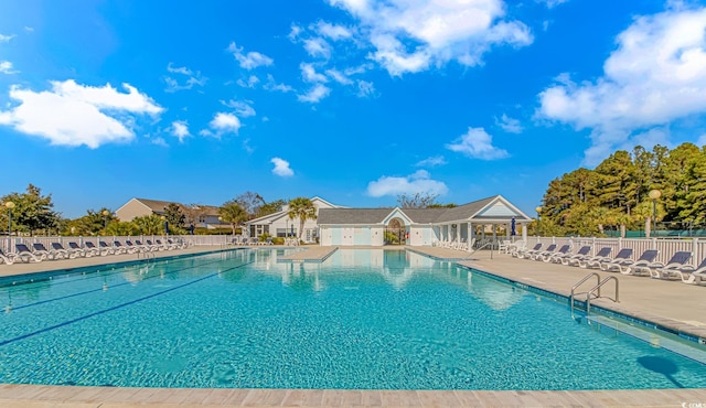 5 Coffee Mill Creek Ln, Carolina Shores, NC 28467 - community pool with fence and a patio