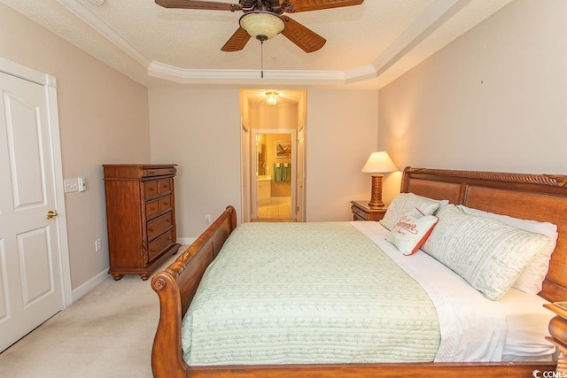 2241 Waterview Dr Unit 315, North Myrtle Beach, SC 29582 - bedroom featuring light carpet, a tray ceiling, baseboards, ensuite bathroom, and ornamental molding