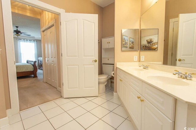 2241 Waterview Dr Unit 315, North Myrtle Beach, SC 29582 - full bath featuring tile patterned floors, toilet, double vanity, a ceiling fan, and connected bathroom