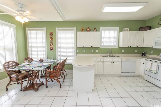 2241 Waterview Dr Unit 315, North Myrtle Beach, SC 29582 - kitchen with white appliances, a sink, light countertops, and white cabinetry