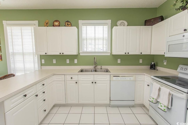 2241 Waterview Dr Unit 315, North Myrtle Beach, SC 29582 - kitchen featuring white appliances, a sink, white cabinets, and light countertops