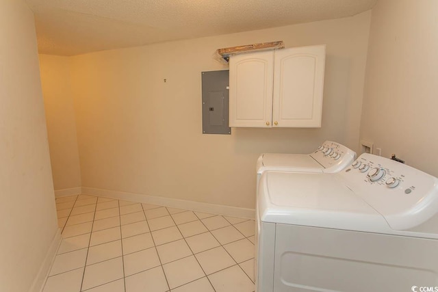 2241 Waterview Dr Unit 315, North Myrtle Beach, SC 29582 - clothes washing area with cabinet space, electric panel, washing machine and clothes dryer, baseboards, and light tile patterned floors