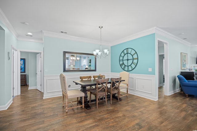 1290 Prescott Cir, Myrtle Beach, SC 29577 - dining room featuring dark wood-style floors, crown molding, a chandelier, and wainscoting
