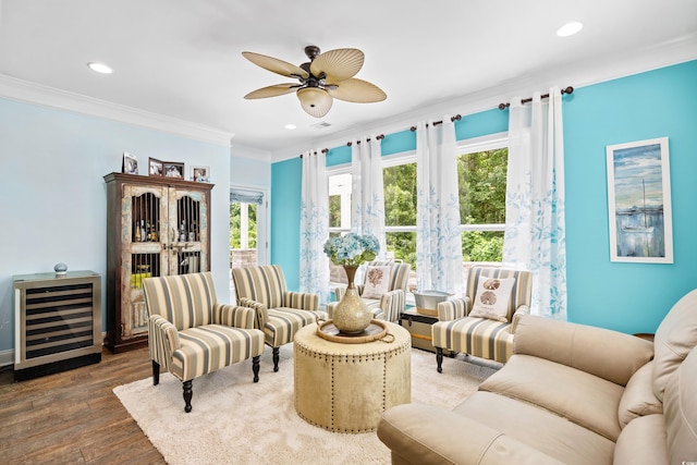 1290 Prescott Cir, Myrtle Beach, SC 29577 - living area with beverage cooler, ornamental molding, ceiling fan, wood finished floors, and recessed lighting