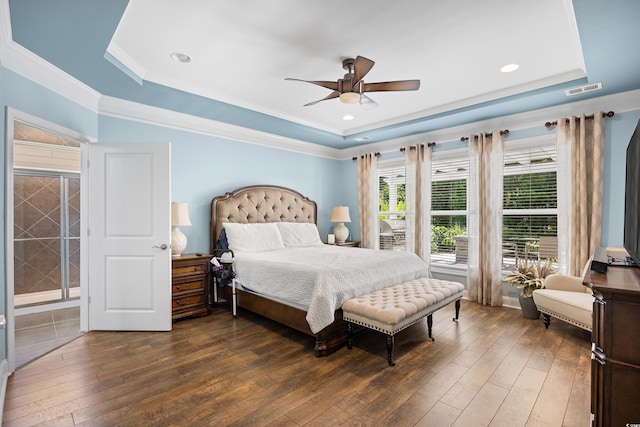 1290 Prescott Cir, Myrtle Beach, SC 29577 - bedroom with a raised ceiling, dark wood-type flooring, ceiling fan, crown molding, and recessed lighting