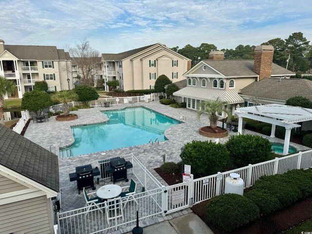 3761 Citation Way Unit 531, Myrtle Beach, SC 29577 - community pool with a fenced backyard, a pergola, area for grilling, and a patio area