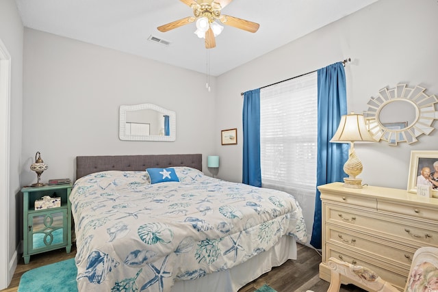 bedroom with wood finished floors and ceiling fan